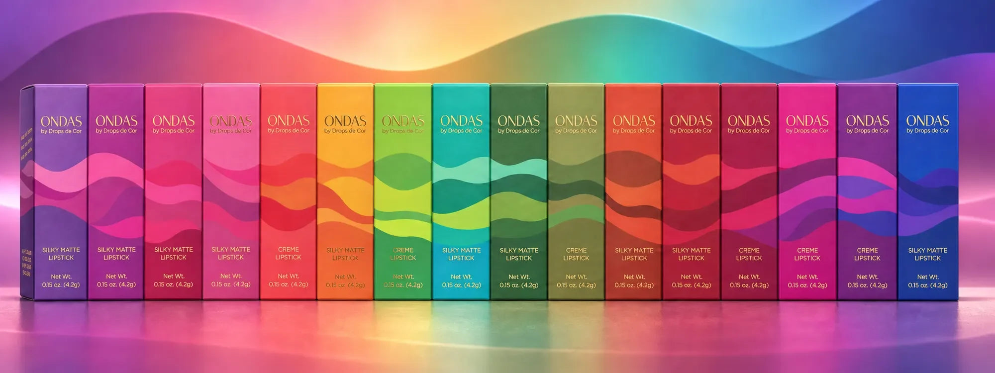 The sixteen ONDAS lipsticks in their cartons, arranged from Summer to Winter